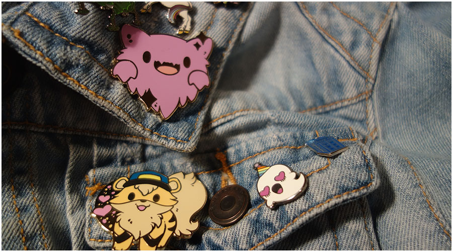 The Haunter and Growlithe pins on my denim jacket next to some of my other pins