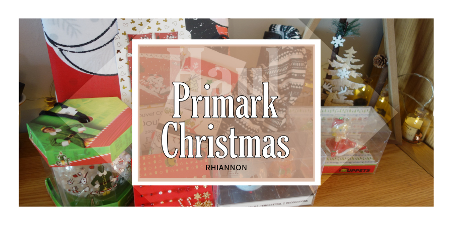 Primark Christmas Haul title image. behind the text box is a phot of the products I bought against a white wall